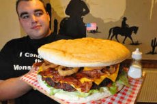 Dale Keys, from Penn, Wolverhampton, with the monster burger at Smokeys in Walsall