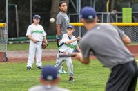 Zander Clark of West Fairlee, VT practices pitching with players from the Vermont Lake Monsters on Centennial Field in Burlington, VT on Friday, Aug. 14, 2015. (Oliver Parini photograph)